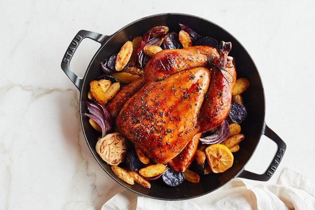 ROAST CHICKEN WITH POTATOES, HERBS, AND LEMON